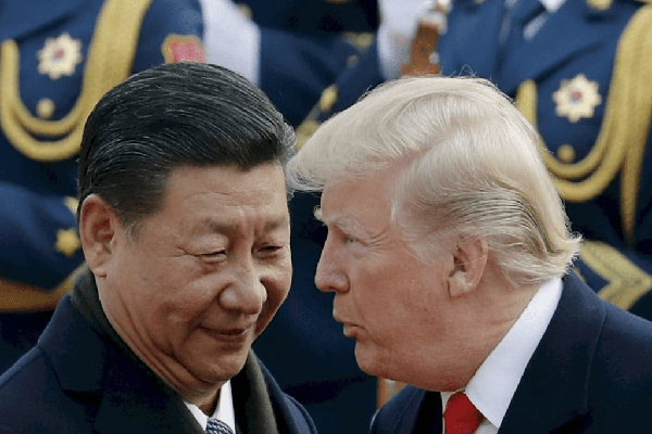 Trump says he will visit China next April.